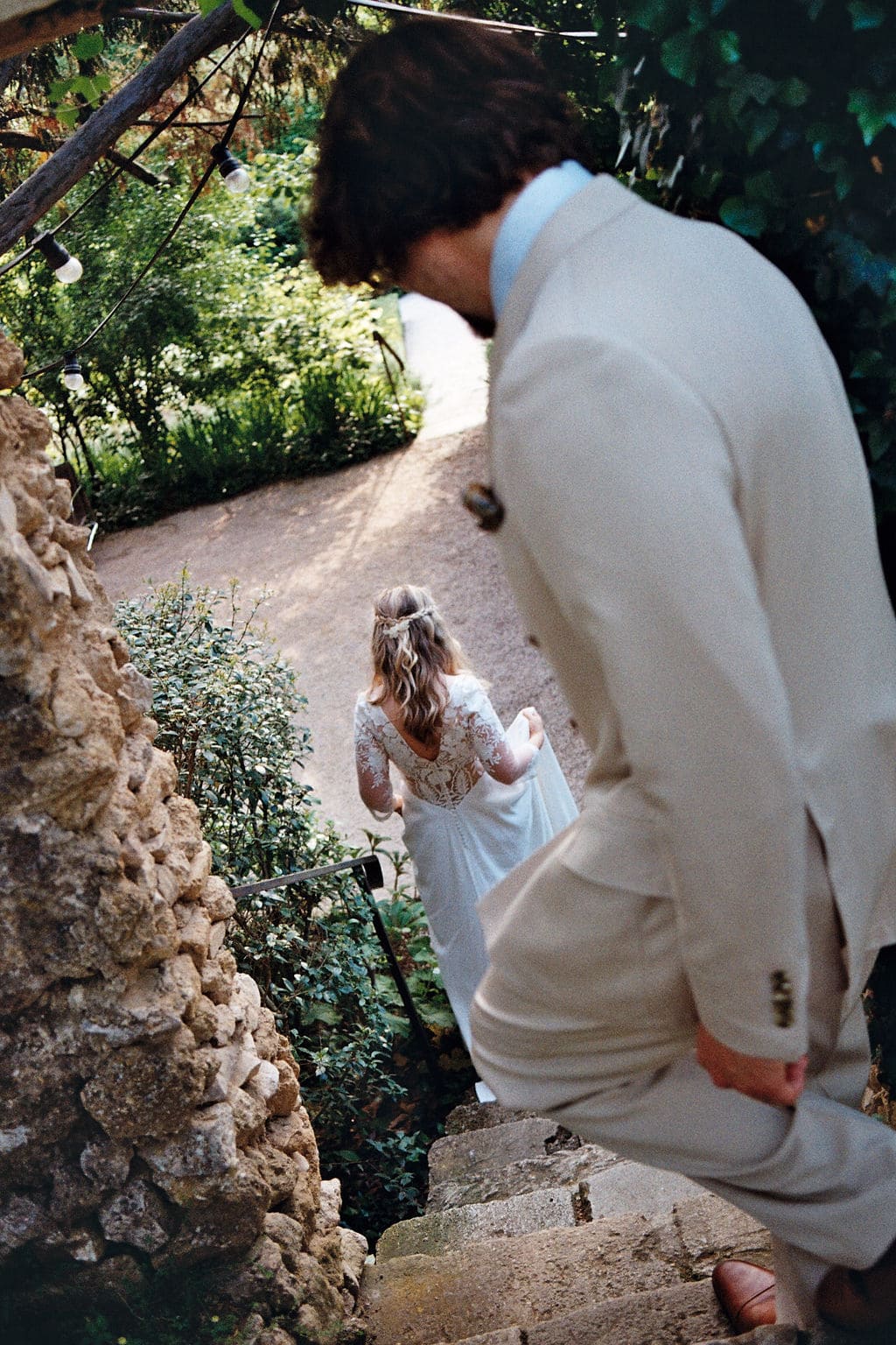 bride and groom going down a stairs