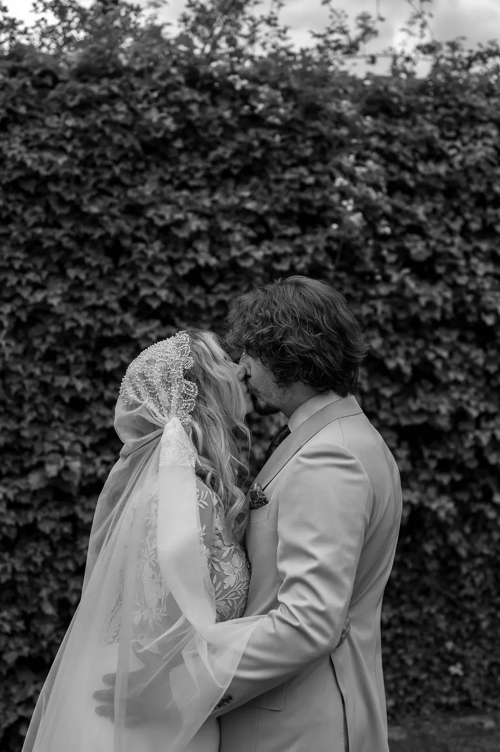 bride and groom kissing right after their union
