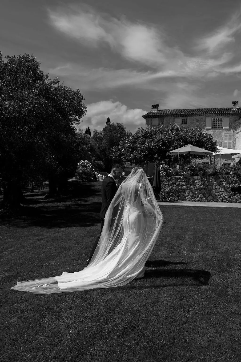 bride playing with her veil dancing in the wind