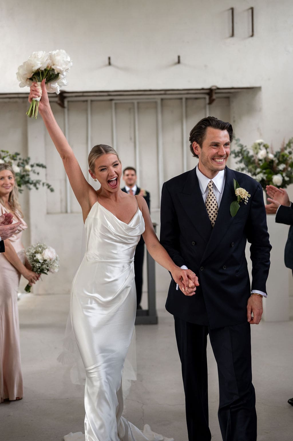 bride and groom walking down the aisle