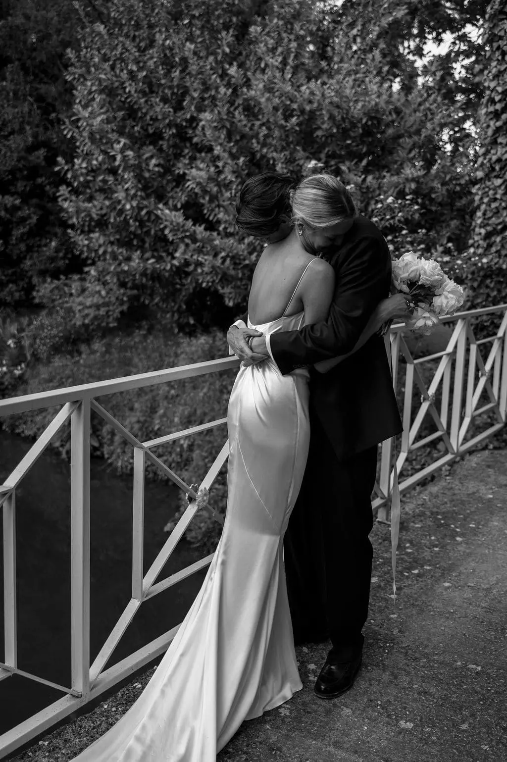 bride and groom hugging each other
