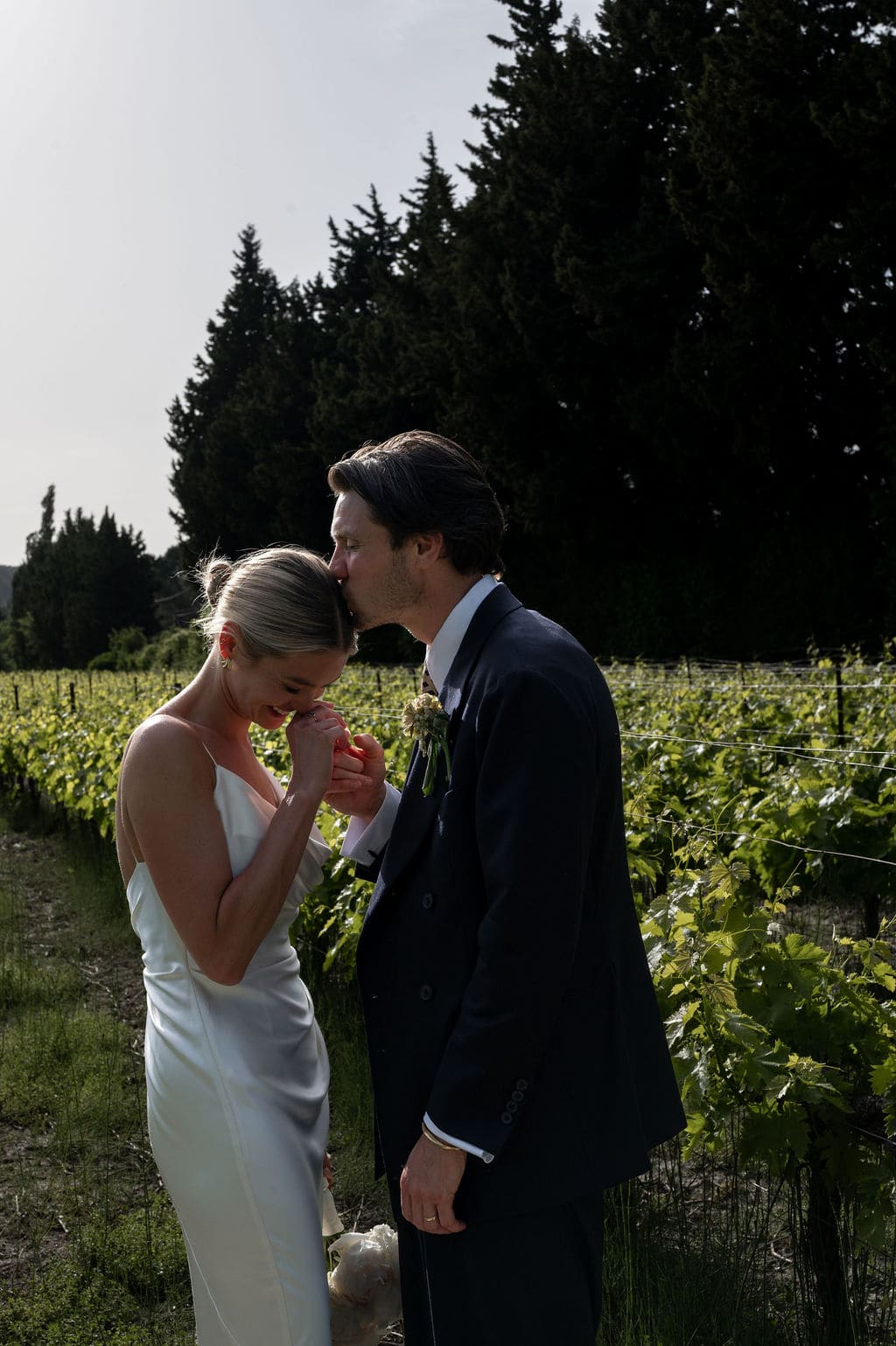 groom being tender with his wife