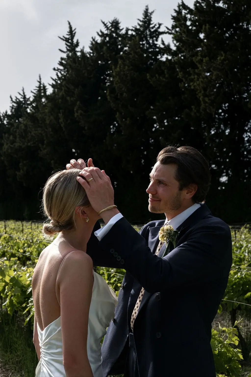 groom being tender with his wife
