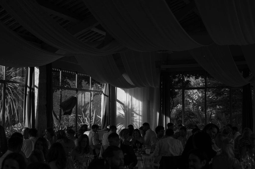 wedding venue table set up inside with backlight sunset