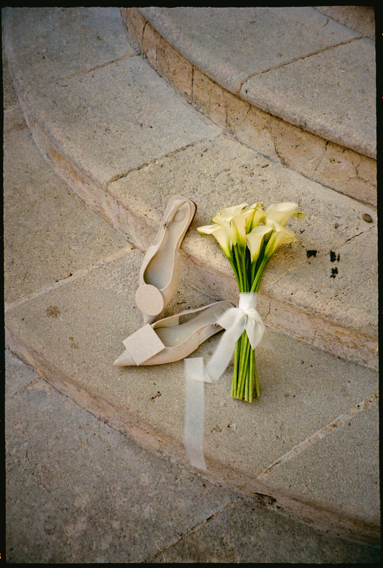 Vivian & Valentin's wedding, Provence, September 2025 Jacquemus shoes and flowers on stairs
