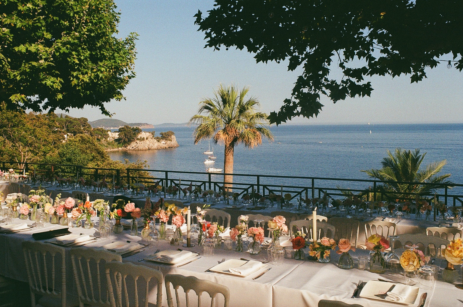 guests seated for ceremony weddings table set with the sea view