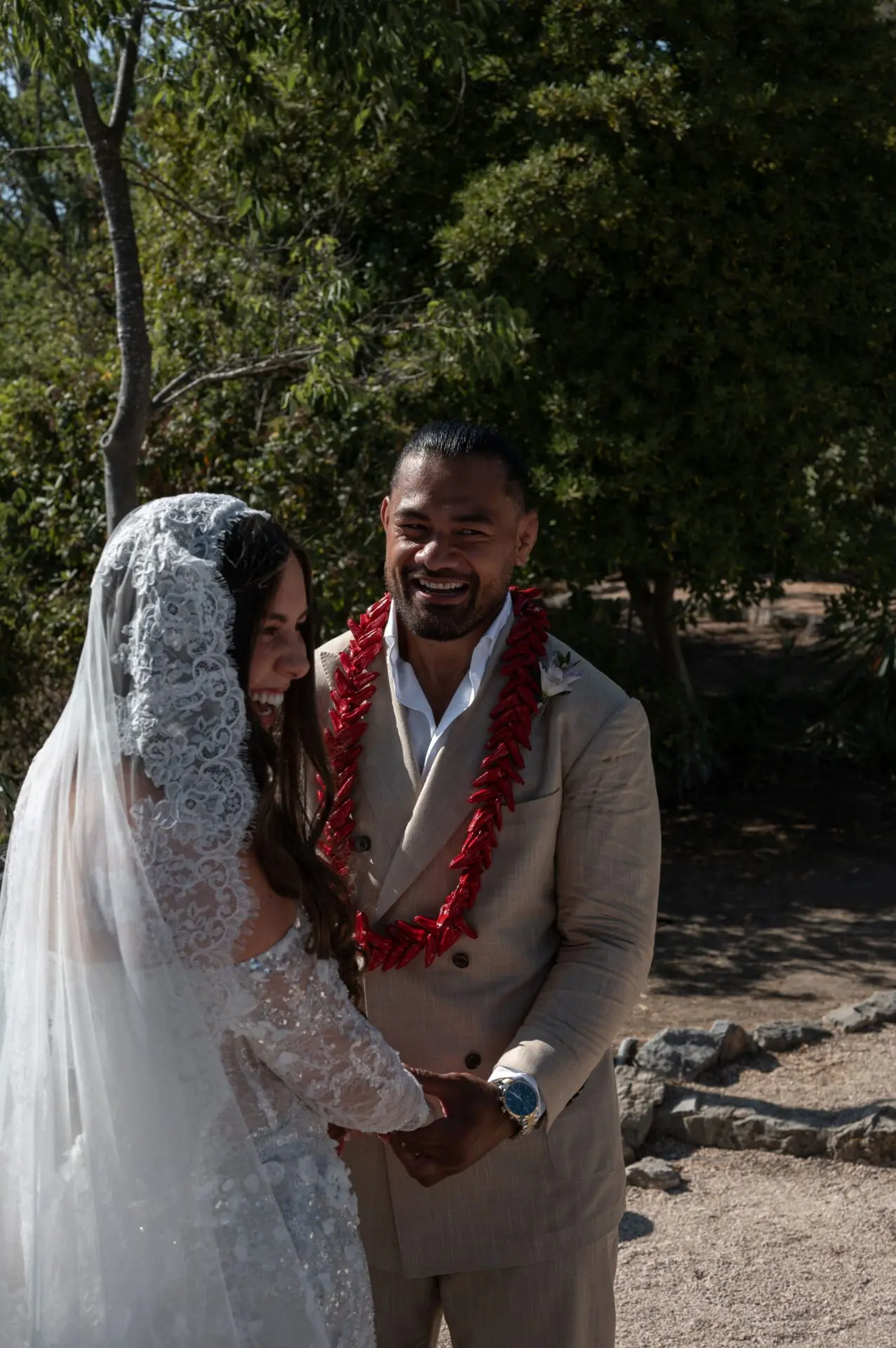 groom looking at his wife during ceremony