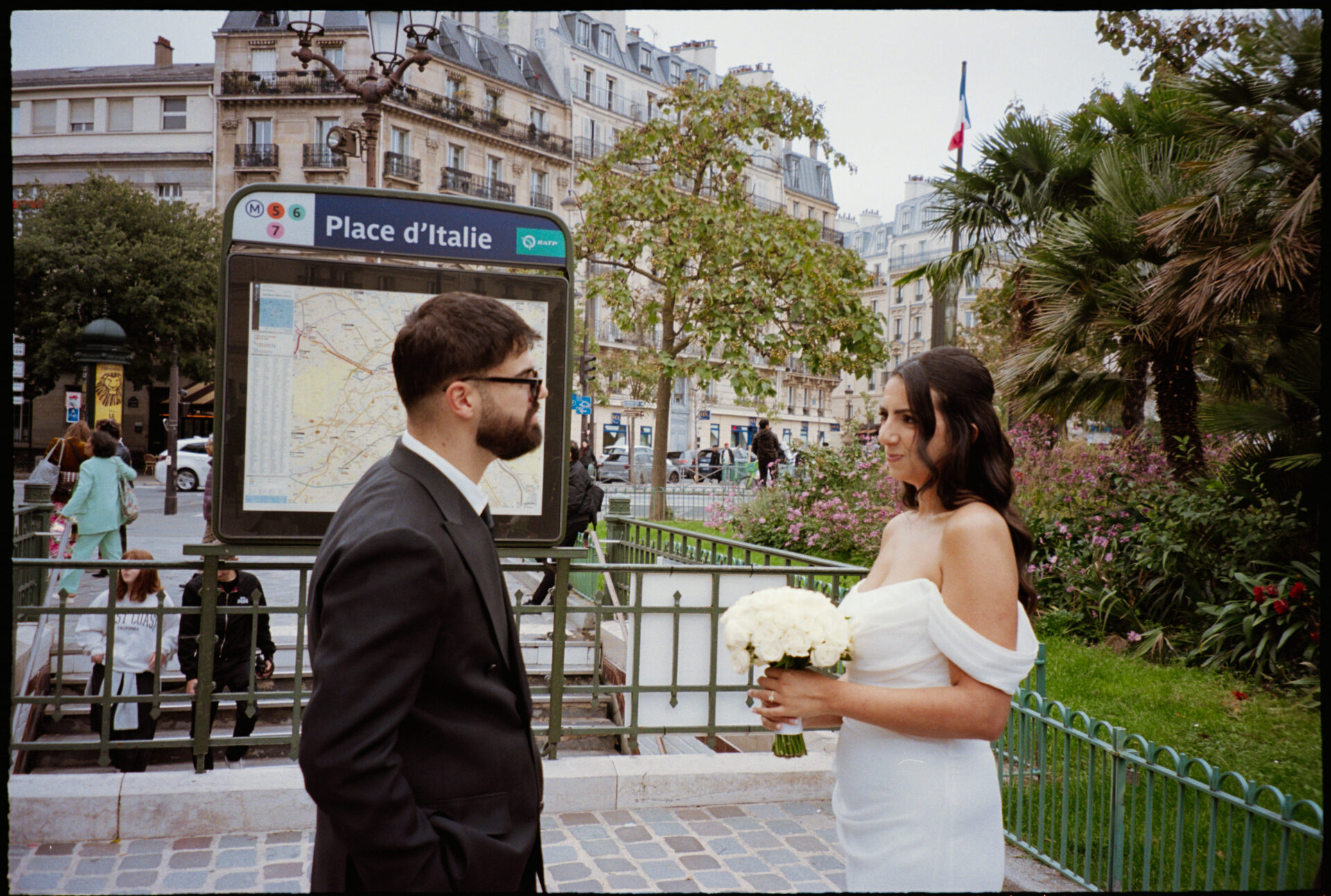 Élodie & Dylan's wedding, Paris, September 2025 bride and groom standing in front of the Parisian subway