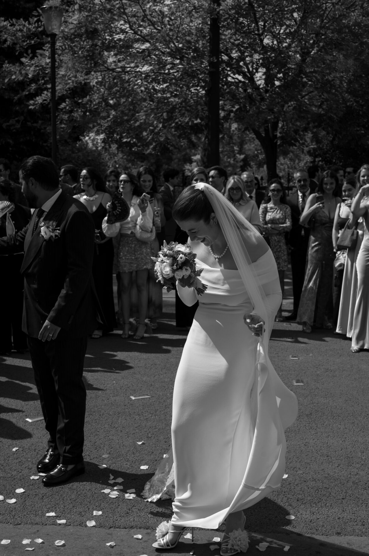 bride and groom making their entrance and guests welcoming them with towels dancing
