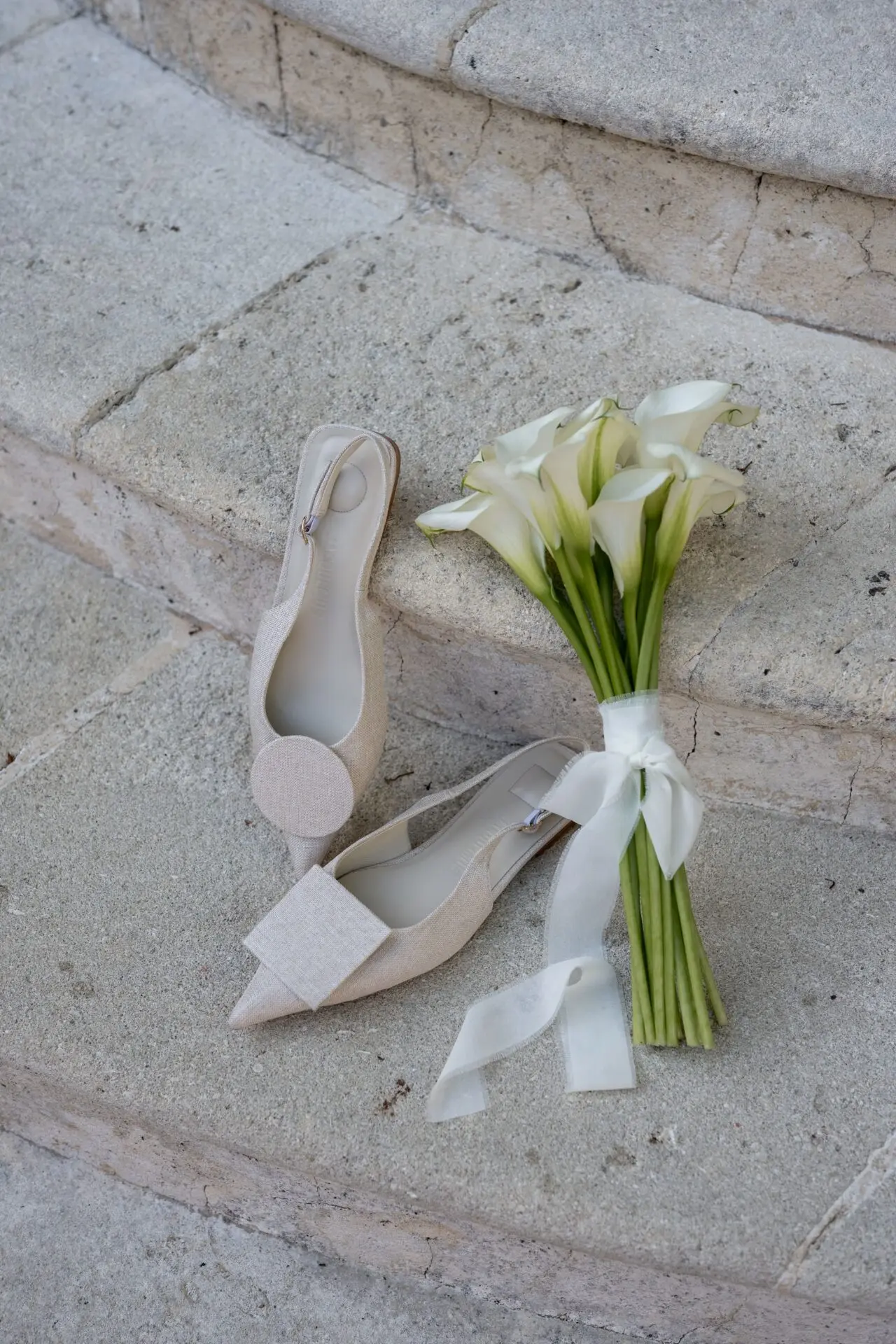 Jacquemus shoes and flowers on stairs